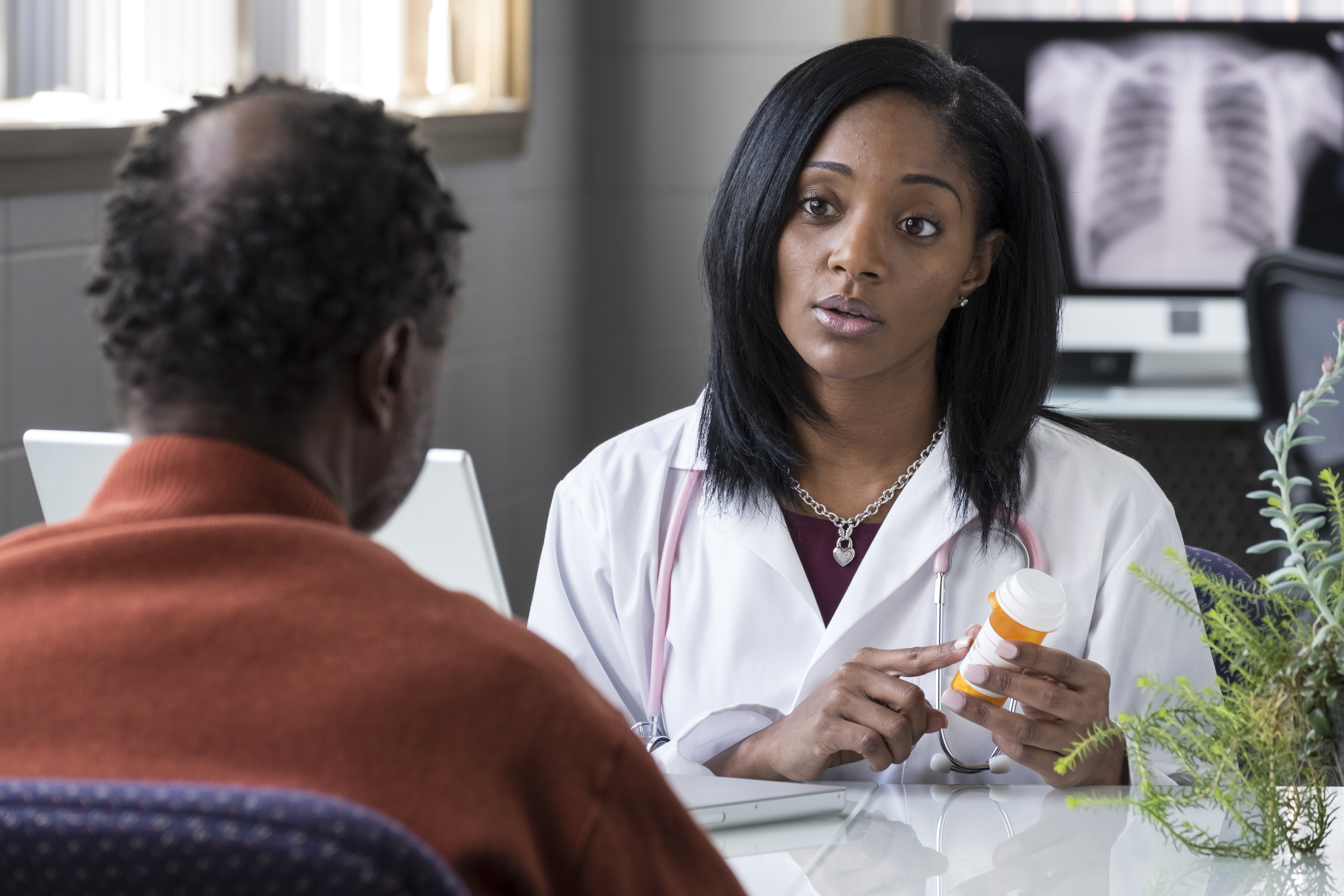 Doctor and patient discussing a prescription medicine