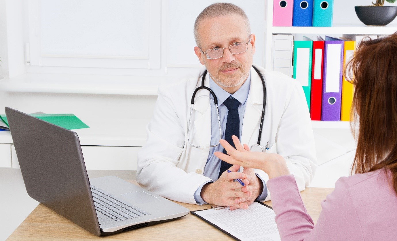 Image showing a woman consulting with a doctor in hospital.