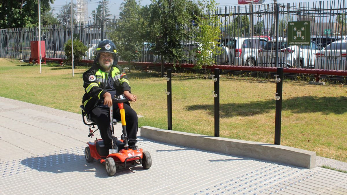 Rodrigo Caceres on his special wheelchair in front of the entrance of the Grünenthal Site in Santiago.