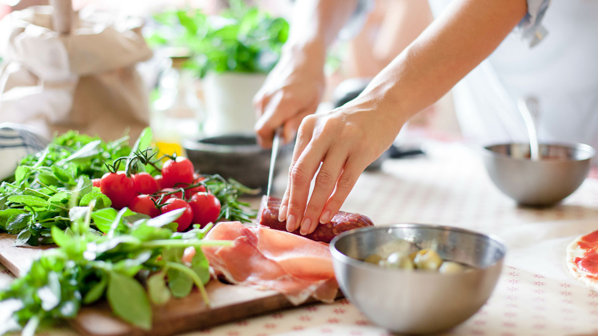 Woman cooking in home kitchen