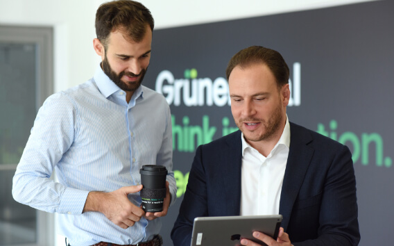 Grünenthal Head Global Communication talking to an employee