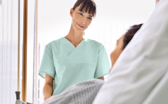 A nurse standing next to a patient
