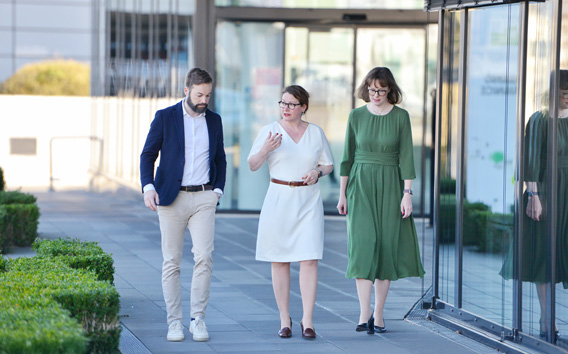 Three colleagues taking a walk