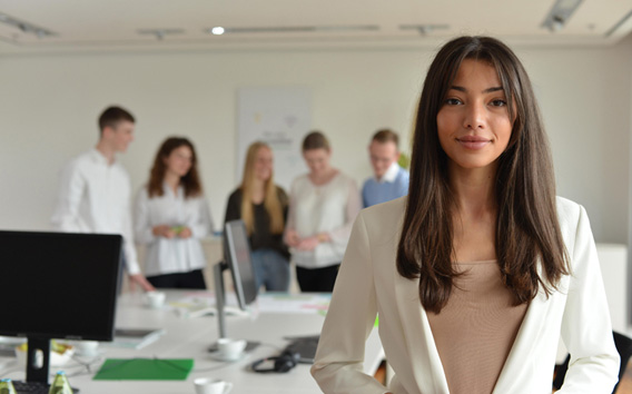 Young woman looking at the camera in an office