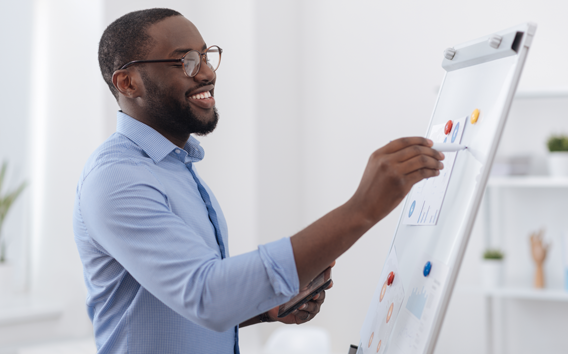 Positive creative man presenting a report 