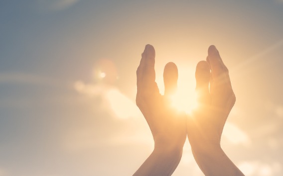 Hands holding up in the sky