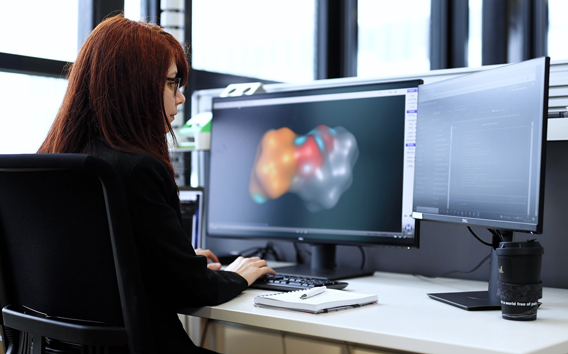 Computational biologist Sevil Davidson working on her desk