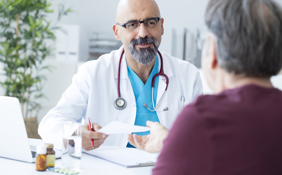 Male doctor talking to patient